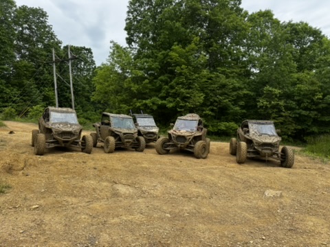 The crew lined up after a muddy ride