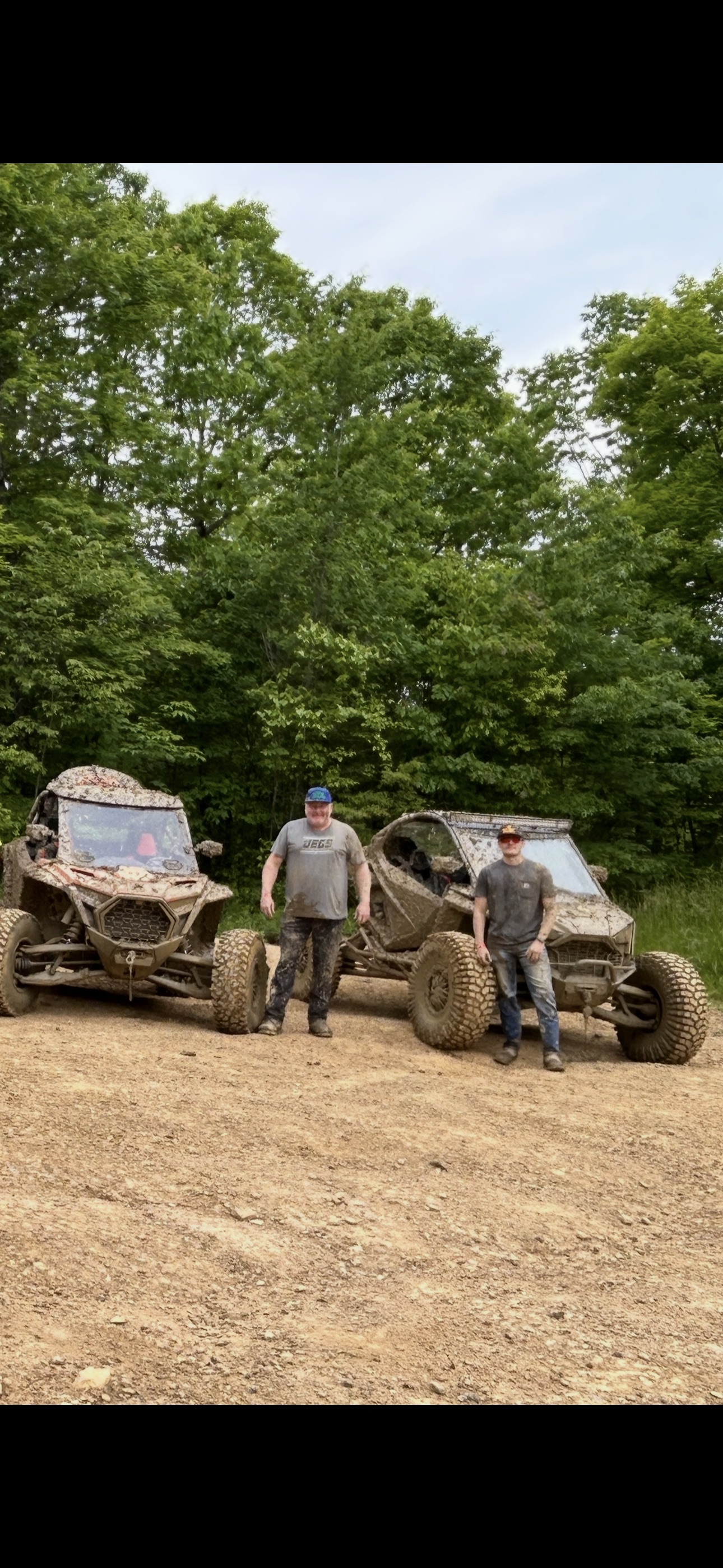 Rugged Rides Media crew with their UTVs after a muddy trail run